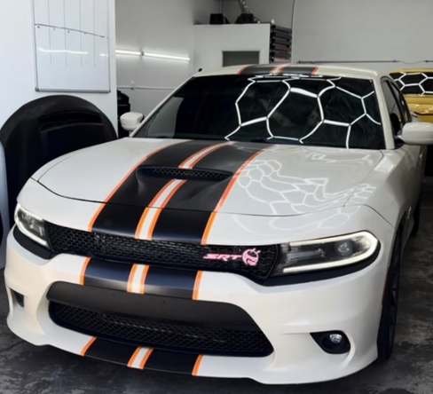 White Charger with black and orange racing stripes